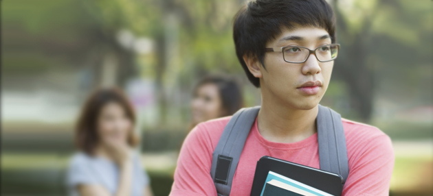 Sad Asian teenage boy